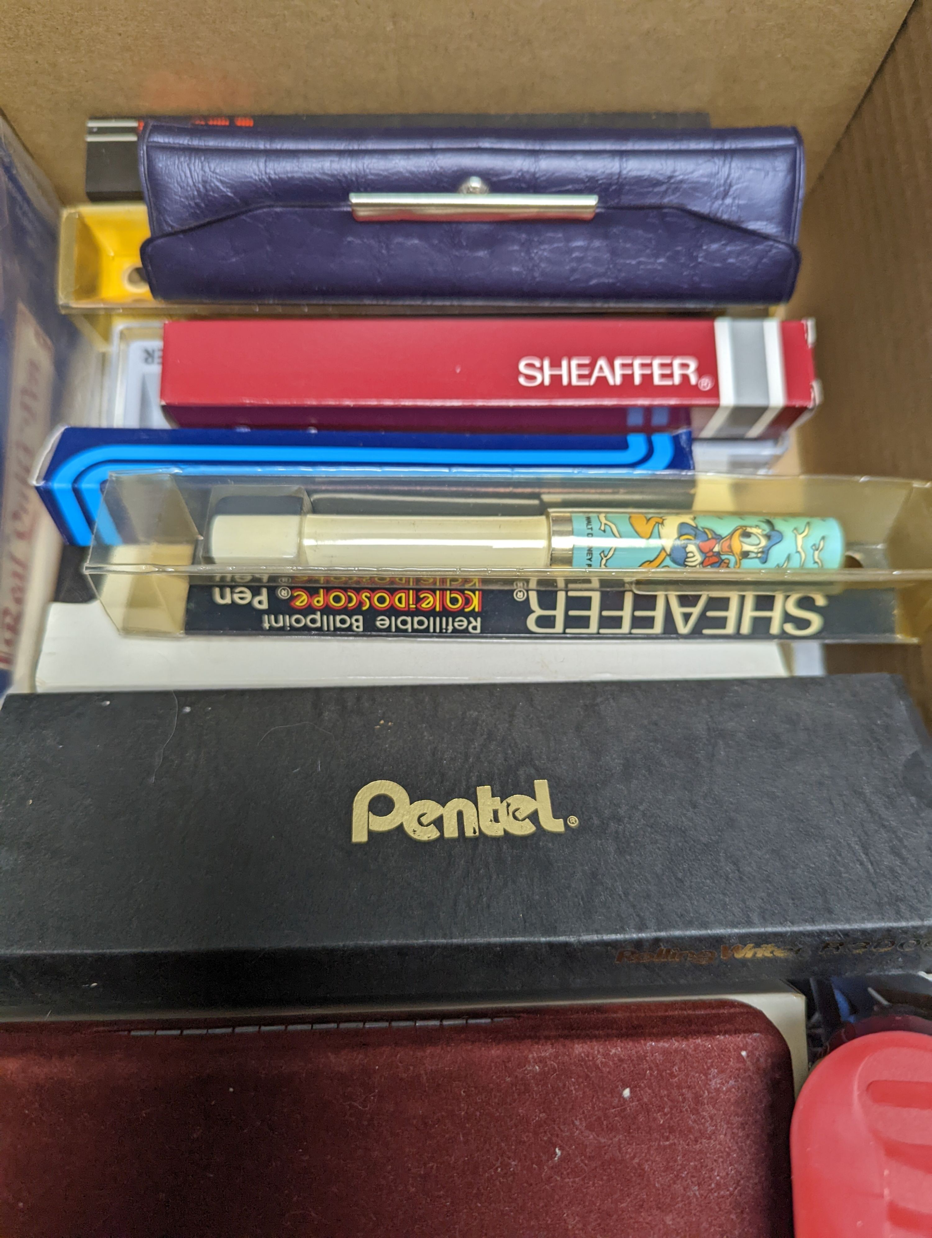 A collection of fountain pens, other pens, pencils and inks
